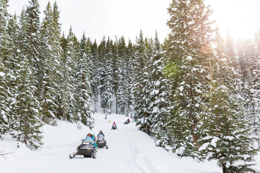 Exploring the snowy terrain around Taos Ski Valley on a snowmobile