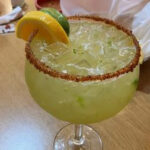 A vibrant Jalapenos Margarita at Iguanas Mexican Restaurant in Brownsburg, Indiana, showcasing the restaurant's colorful drink options.