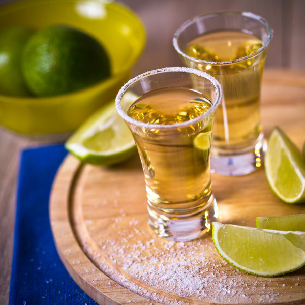 A tequila tasting setup at a Mexican fiesta birthday party, offering an engaging activity for guests.