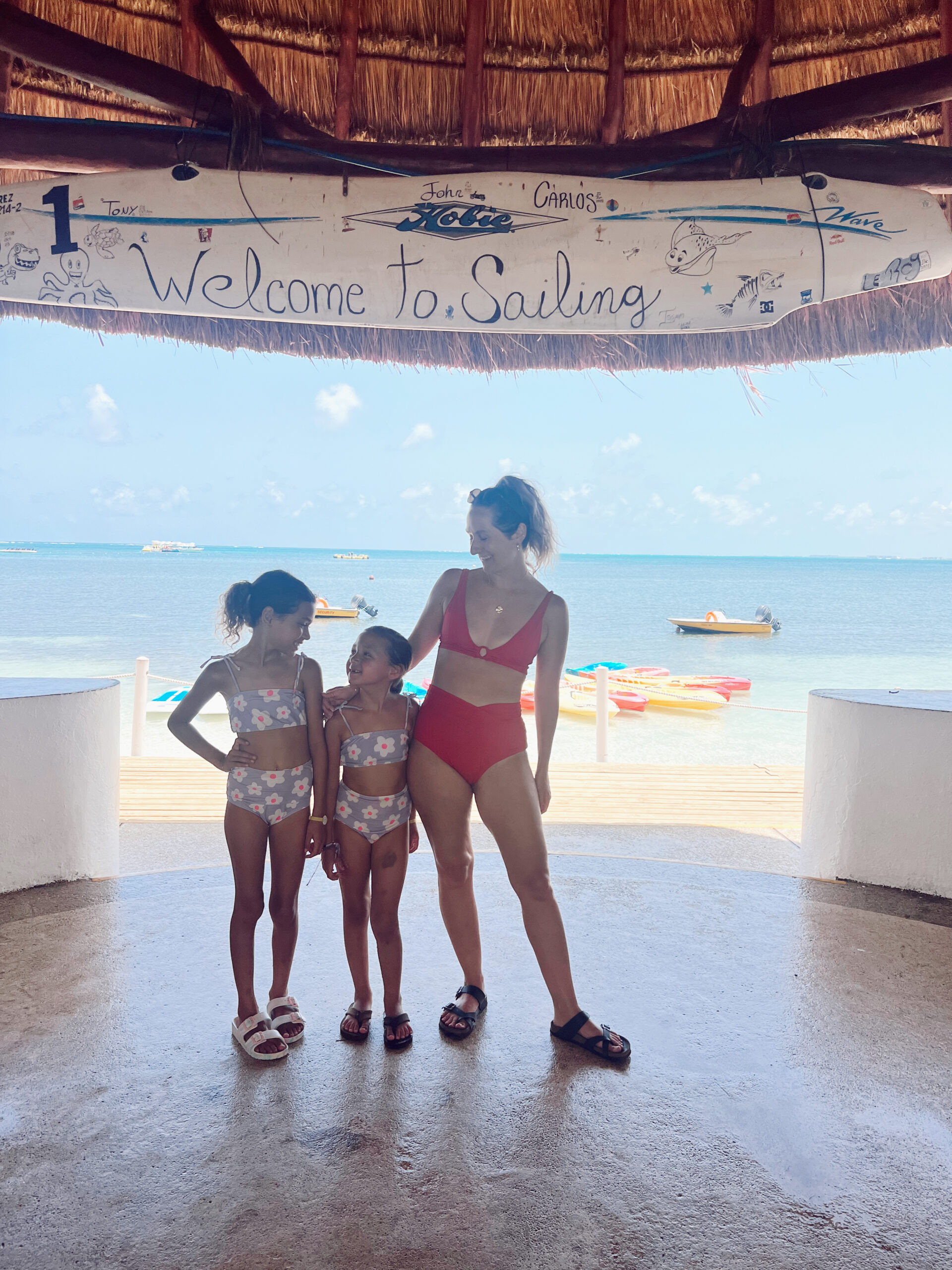 Family participating in archery at Club Med Cancun, showcasing the variety of land-based activities