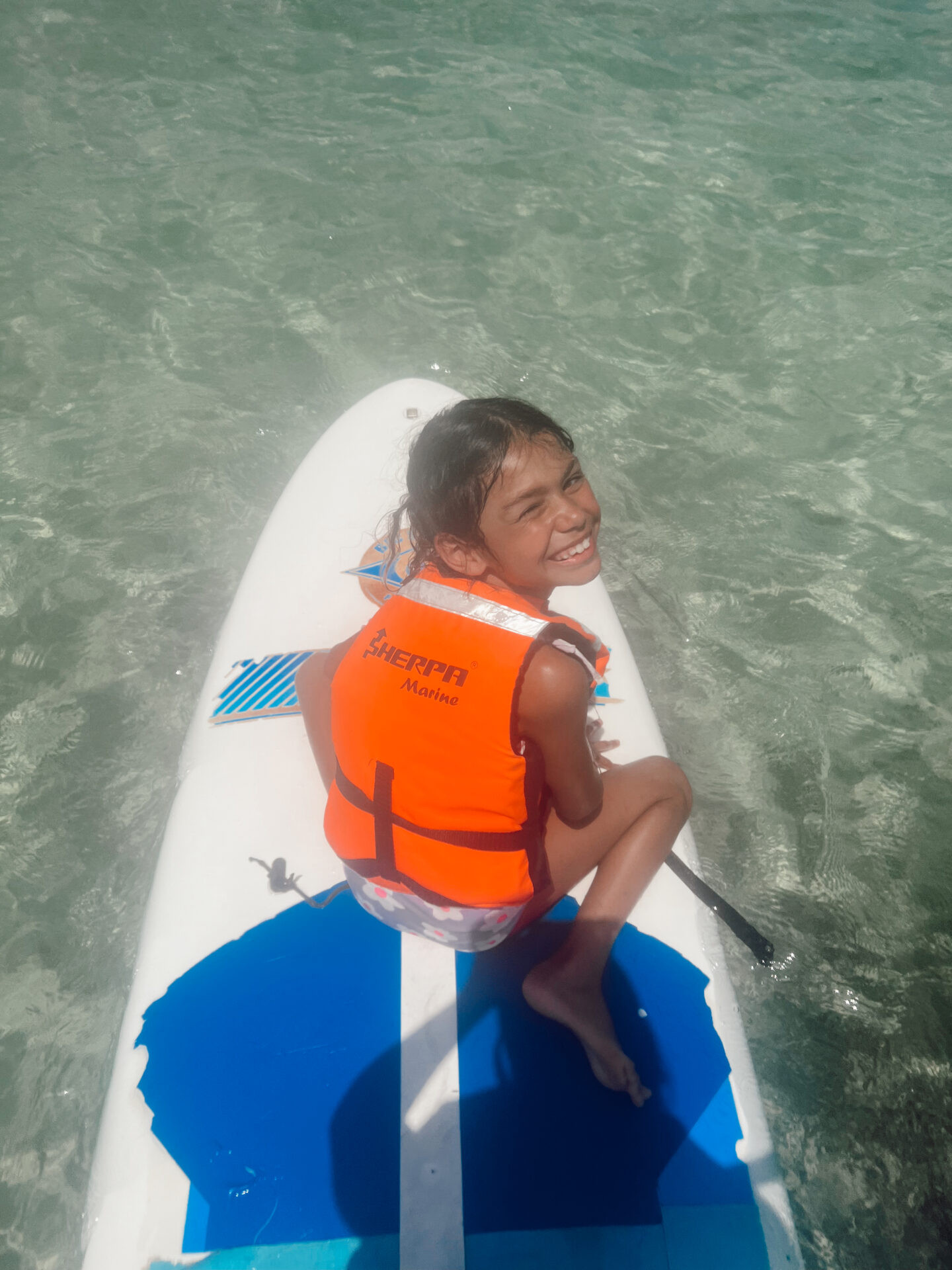 Guest windsurfing at Club Med Cancun, highlighting the range of water sports for all skill levels