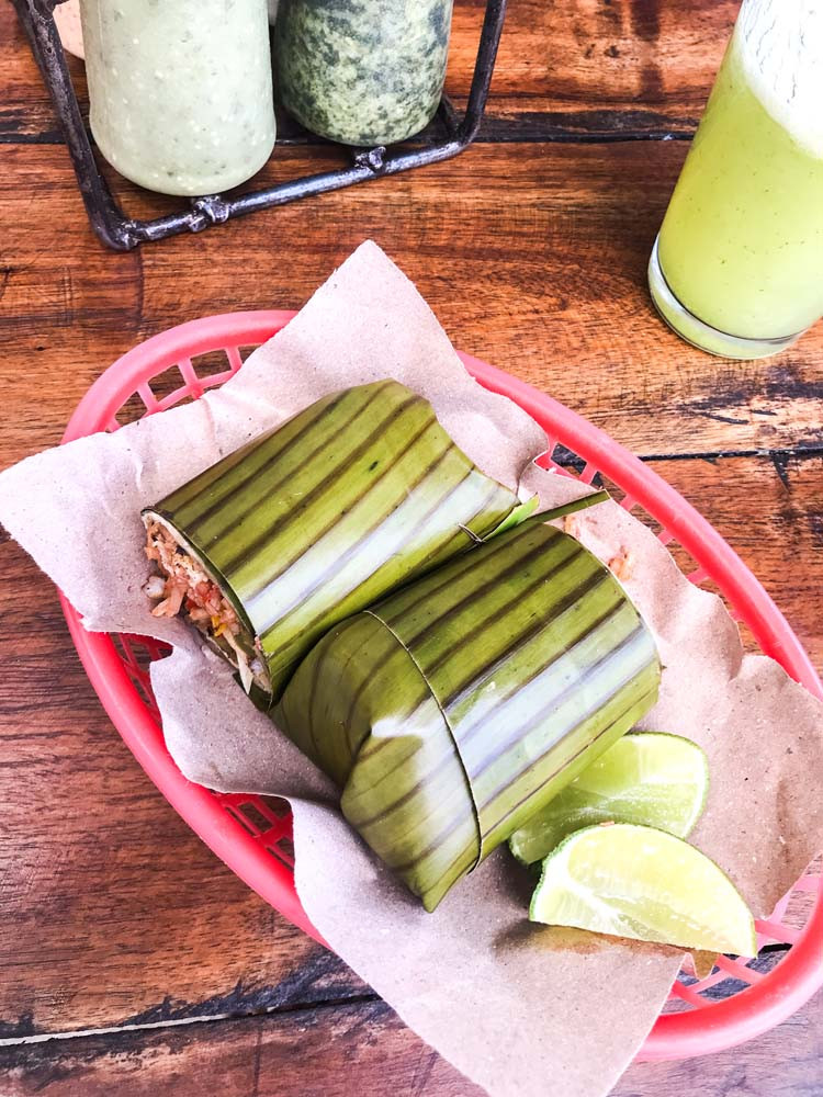 Burrito wrapped in banana leaf at Burrito Amor, Tulum