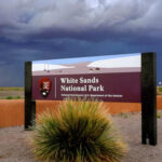 Sign at the entrance of White Sands National Park in New Mexico, welcoming visitors.