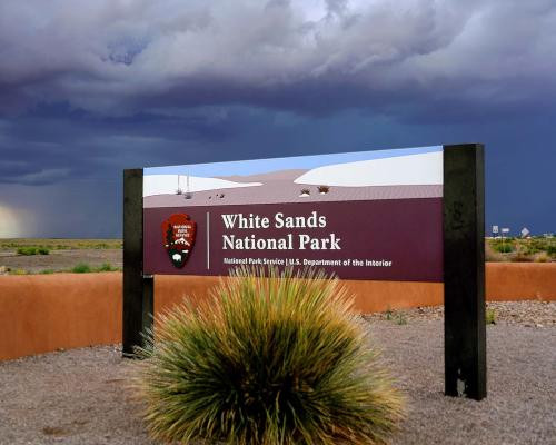 Sign at the entrance of White Sands National Park in New Mexico, welcoming visitors.