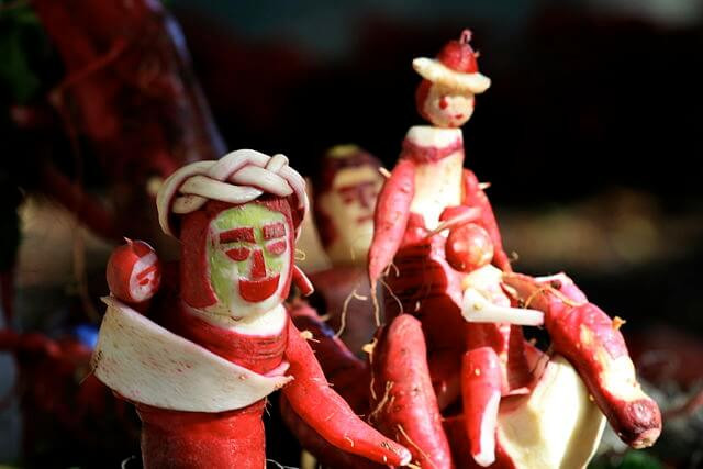 Intricate radish carvings displayed at the Night of the Radishes festival in Oaxaca, a unique regional Mexican Christmas tradition.