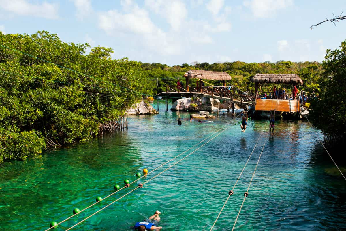 Ziplining over a lagoon in Xel-Ha Cancun