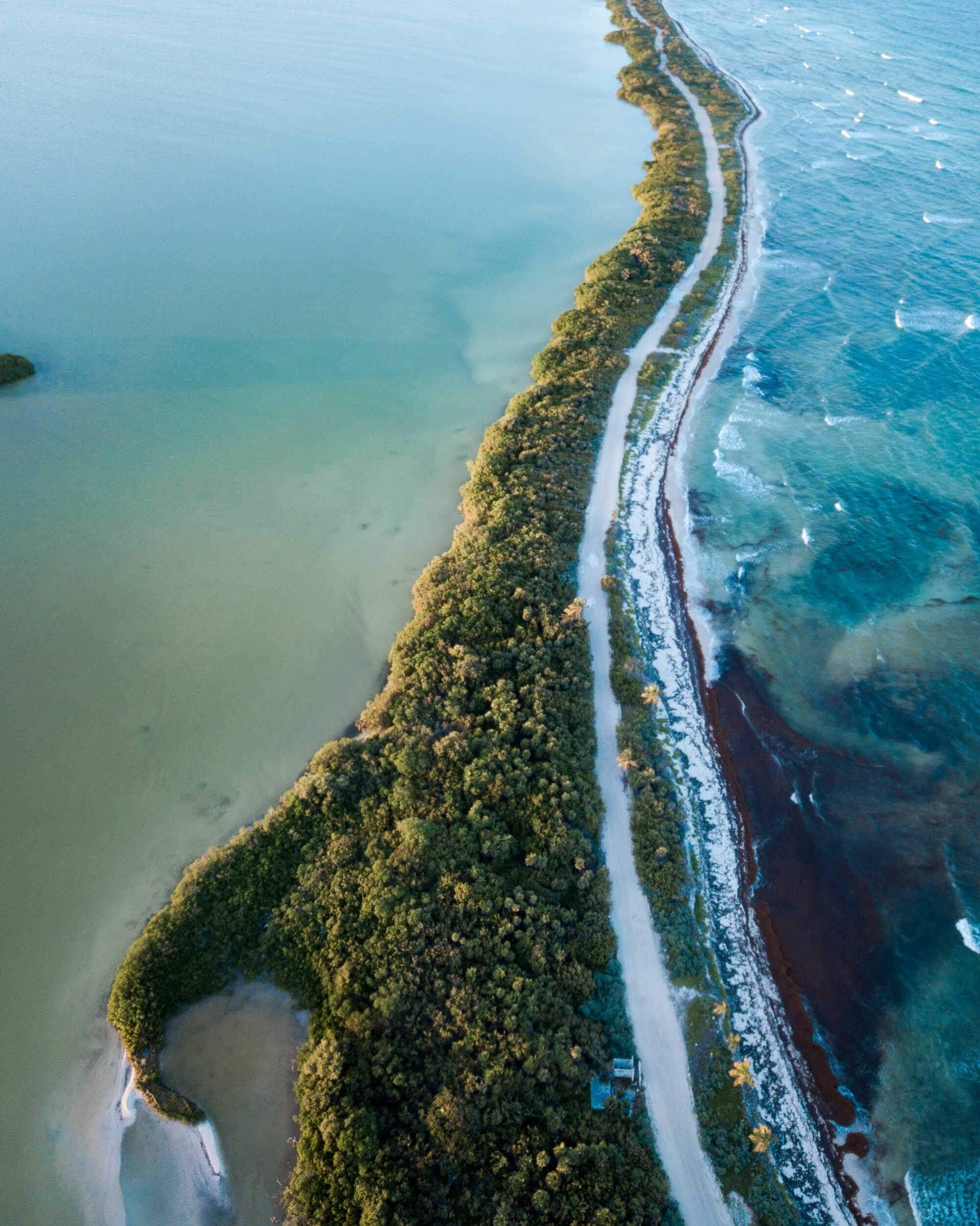 An expansive aerial view of the diverse ecosystems within Sian Ka’an Biosphere Reserve, Yucatan Peninsula, Mexico.