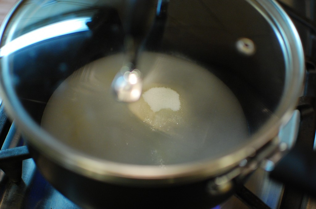 Sugar and water mixture cooking on the stovetop.