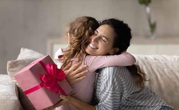 El Día de la Madre | Photo of Young Daugther and Mother Hugging