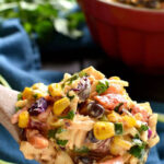 A colorful bowl of Mexican Coleslaw with black beans, corn, and cilantro.