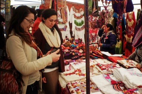 Women shopping for hand-made souvenirs in Progreso, Mexico
