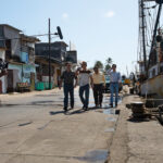 Behind-the-scenes shot of Tijuana cartels walking down pier shot in Veracruz, Mexico for Narcos: Mexico Season 3 shot by Nicole Franco for Netflix