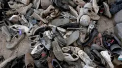 Getty Images Shoes and other belongings have been found at the site of three alleged clandestine crematoriums