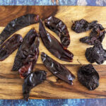 A vibrant display of dried chilies, essential for creating authentic Mexican adobo sauce, capturing the essence of Mexican culinary heritage.