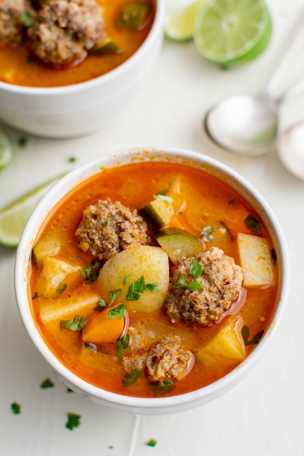 Bowl of Albondigas Soup with Lime and Cilantro