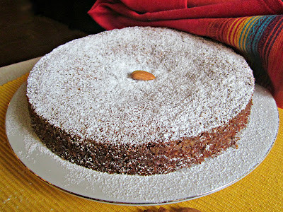 Torta De Cielo (Mexican Almond Cake) displayed on a white cake stand.
