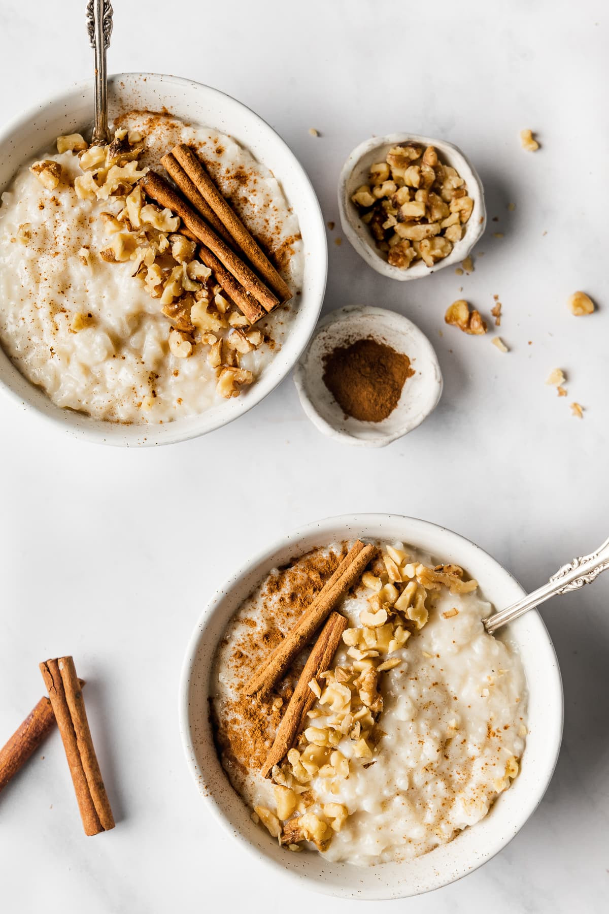 Close up of a bowl of Arroz con Leche with toppings.