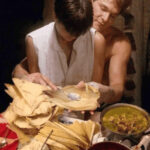 Man and woman recreating scene from the movie Ghost with tamales