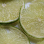Cut lime pieces. Close up image of a halved lime