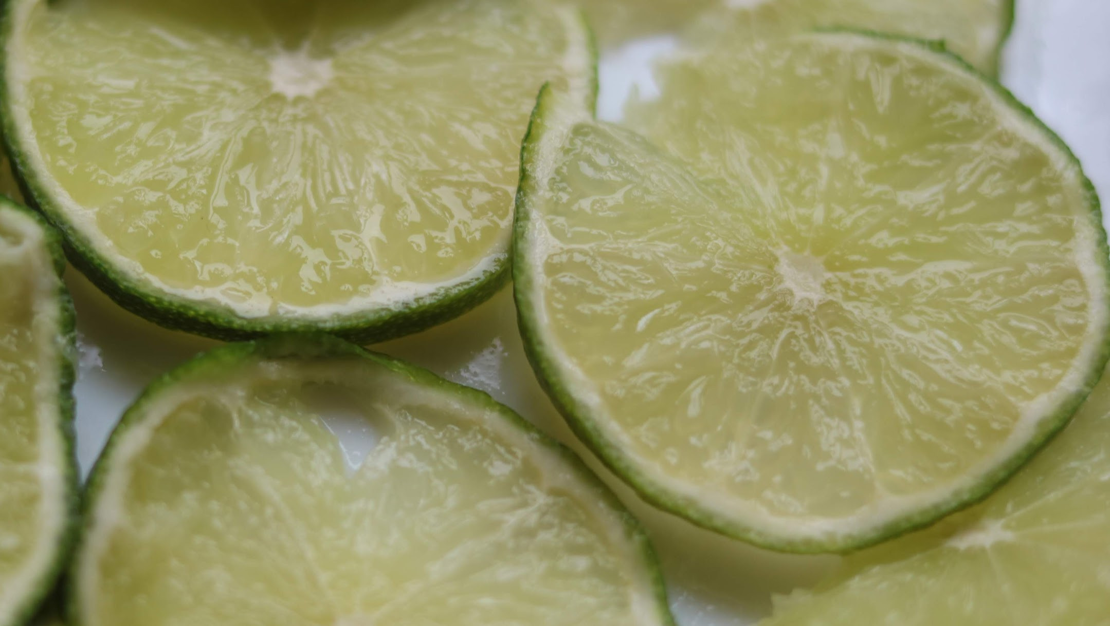 Cut lime pieces. Close up image of a halved lime
