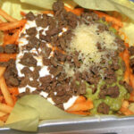 Carne Asada Fries from Albertaco’s in Cypress, CA, a popular snack made of french fries, carne asada, cheese, guacamole, and sour cream