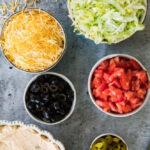 A bowl of fresh guacamole with tortilla chips.