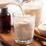 Mexican horchata being served into a glass with ice