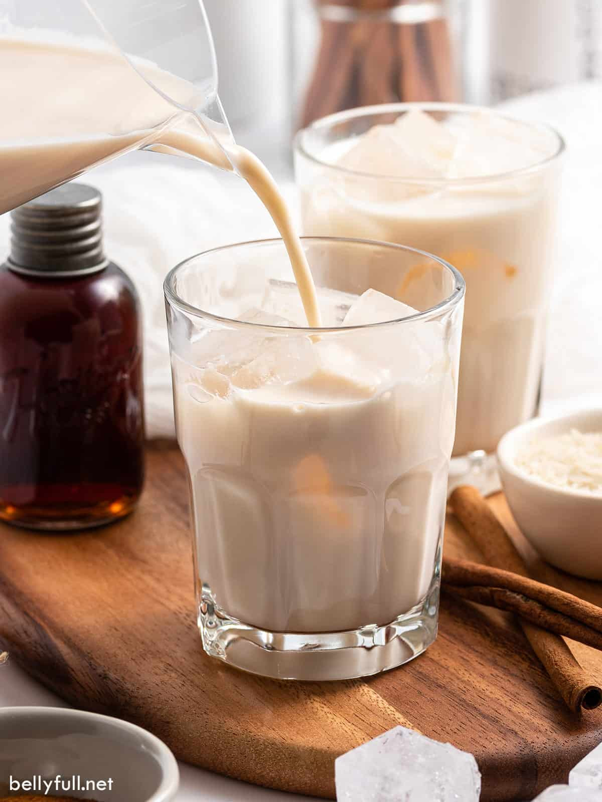 Mexican horchata being served into a glass with ice