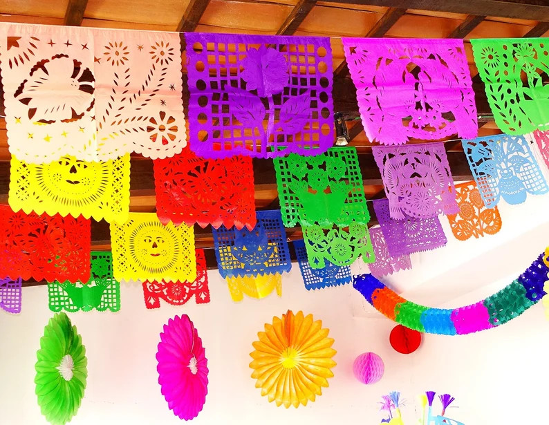 Intricate papel picado banners hanging as a Mexican decoration