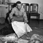 At Fort Worth Army Air Field, Major Jesse A. Marcel holds foil debris from Roswell, New Mexico during the so-called UFO incident. Courtesy, Fort Worth Star-Telegram Photograph Collection, Special Collections, The University of Texas at Arlington Library, Arlington, Texas
