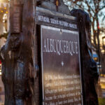Historic marker sign explaining Albuquerque's name and history