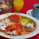Huevos Rancheros, a staple of Mexican breakfast, featuring fried eggs on tortillas with salsa