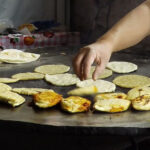 Mexican street food breakfast, including gorditas and tlacoyos, perfect for a quick and tasty morning meal