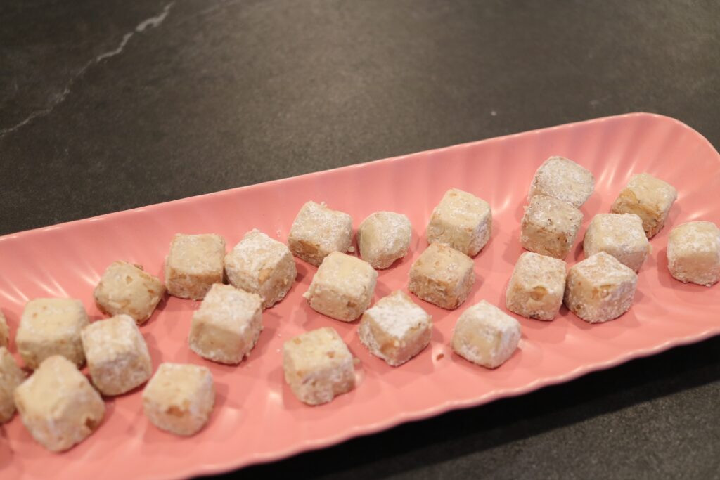 Mexican wedding cookies with powdered sugar dusting, symbolizing purity and a sweet beginning