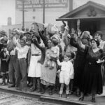 Relatives and friends wave goodbye to a train carrying 1,500 people being expelled from Los Angeles to Mexico in August 1931