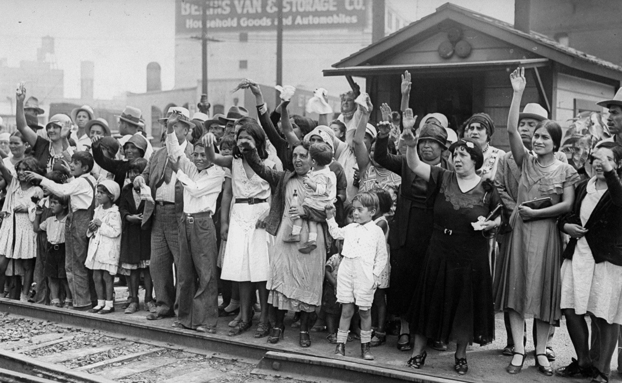 Relatives and friends wave goodbye to a train carrying 1,500 people being expelled from Los Angeles to Mexico in August 1931