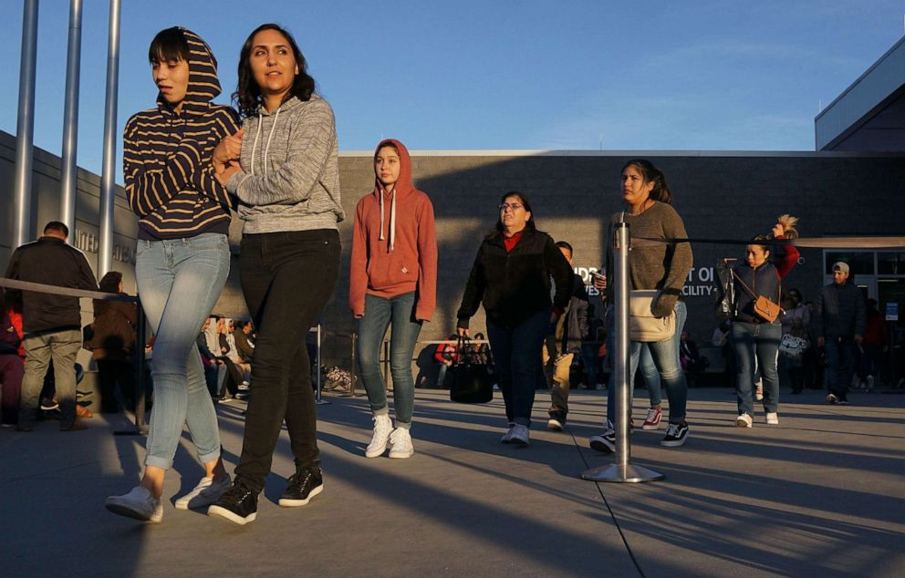 Pedestrians exiting the San Ysidro Port of Entry along the U.S./Mexico border, illustrating cross-border travel and commerce.