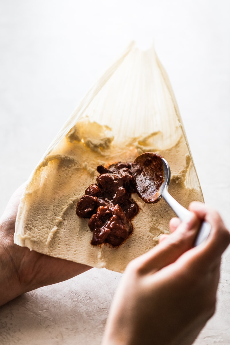 Pile of dried corn husks, essential for making authentic Mexican tamales.