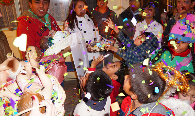 Posada celebration featuring traditional Mexican clothing.