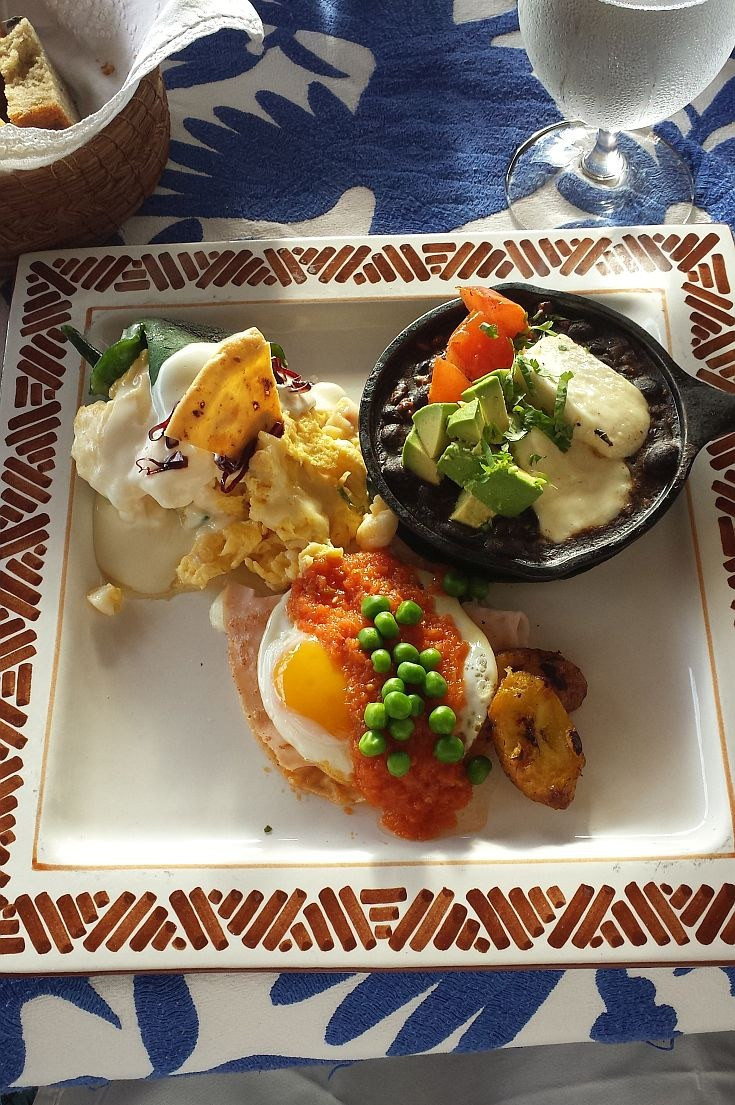 A vibrant and colorful Mexican breakfast spread at a restaurant in Puerto Vallarta, known for its LGBTQ+-friendly atmosphere