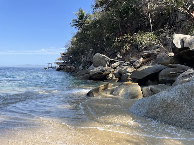 Quiet beach in Puerto Vallarta with palm trees