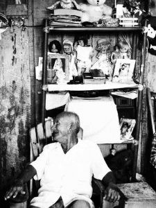 Witch's altar decorated with shamanic and Christian motifs, saints and demons with shady portraits and astral lines