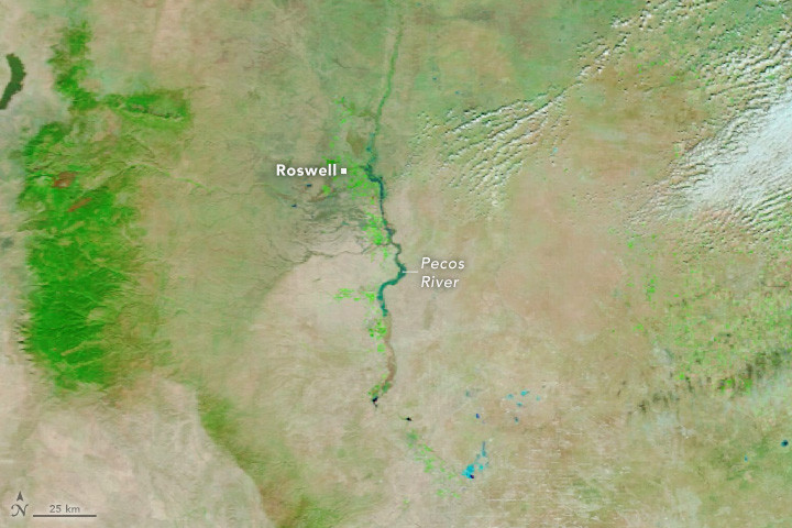 Aerial view of flooded fields and roads near Roswell, New Mexico, on October 21, 2024, showcasing the extent of the damage