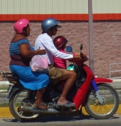 Three people on moterbike
