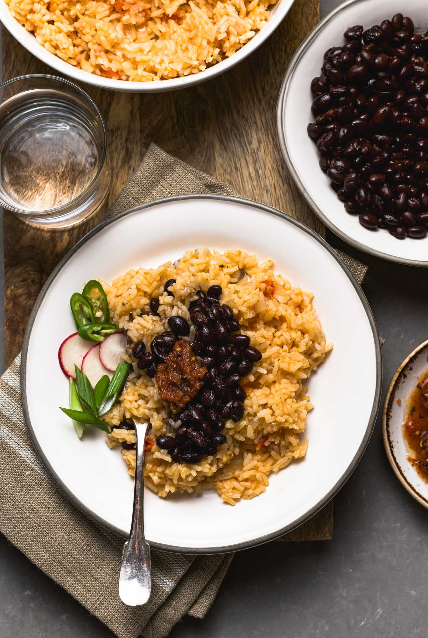 Mexican Rice Ingredients: Cooked rice, tomato sauce, onions, garlic, spices