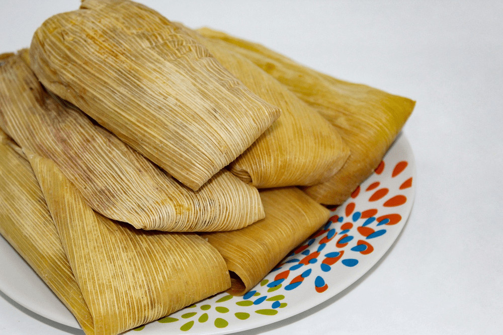 Tamales, corn dough parcels filled with meat, cheese, beans, vegetables or fruits, wrapped in corn husks or banana leaves and steamed, an ancient dish with many variations across Mexico
