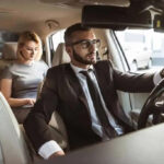 Driver with a woman in the back seat