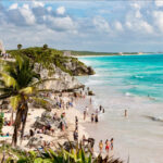 The famous beaches of Tulum, Mexico with Mayan ruins looming on the cliff above