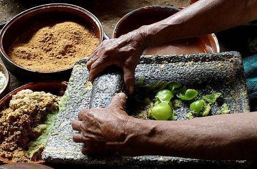A woman making tortillas