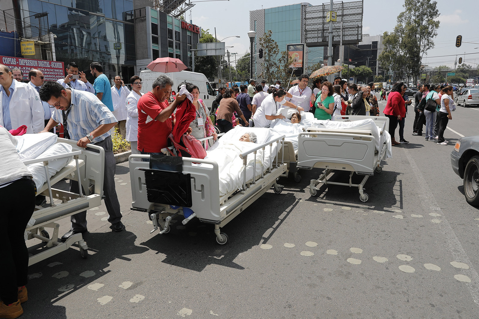 Patients from a Mexico City hospital receive treatment outside after the hospital was evacuated due to the earthquake